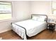 Bright bedroom with wood floors and ample natural light from two windows at 877 Verona Dr, Clarkston, GA 30021