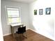 Light-filled room with wood floors, desk, and a large window providing natural light at 877 Verona Dr, Clarkston, GA 30021