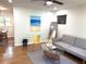 Bright living room with a view into the dining room and hardwood floors at 877 Verona Dr, Clarkston, GA 30021