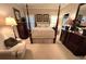 Cozy bedroom featuring a four-poster bed and comfortable seating at 962 Manor Parc Dr, Decatur, GA 30033
