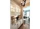 Elegant butler's pantry with granite countertops, glass-front cabinets, and stylish lighting, adding a touch of luxury at 962 Manor Parc Dr, Decatur, GA 30033
