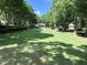 Expansive green space with mature trees creating a serene park-like setting at 962 Manor Parc Dr, Decatur, GA 30033