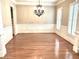 Bright dining area featuring hardwood floors, crown molding and modern light fixture at 962 Manor Parc Dr, Decatur, GA 30033