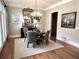 Charming dining room with hardwood floors, chandelier lighting, and elegant decor, perfect for Gathering dinners and entertaining at 962 Manor Parc Dr, Decatur, GA 30033