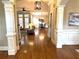 Elegant entryway showcases hardwood floors and decorative columns leading to the living and dining areas at 962 Manor Parc Dr, Decatur, GA 30033