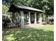 Charming stone gazebo with seating in a tranquil park setting, perfect for relaxing at 962 Manor Parc Dr, Decatur, GA 30033