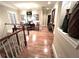 Upper hallway with hardwood floors and a view of the staircase, showcasing the home's elegant design at 962 Manor Parc Dr, Decatur, GA 30033