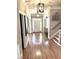Spacious hallway featuring hardwood floors, stairs and elegant light fixtures at 962 Manor Parc Dr, Decatur, GA 30033