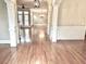 Bright hallway featuring beautiful hardwood floors, and elegant white columns at 962 Manor Parc Dr, Decatur, GA 30033