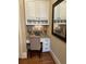 Convenient home office nook with a built-in desk, cabinets, and granite countertops, providing a functional workspace at 962 Manor Parc Dr, Decatur, GA 30033