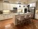 Well-lit kitchen featuring an island with seating, stainless steel appliances, and ample counter space at 962 Manor Parc Dr, Decatur, GA 30033