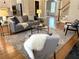 Inviting living room with hardwood floors, a plush sofa, and elegant decor creating a comfortable atmosphere at 962 Manor Parc Dr, Decatur, GA 30033