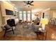 Stylish living room with a fireplace, built-in shelves, and hardwood floors, perfect for relaxation and entertaining at 962 Manor Parc Dr, Decatur, GA 30033