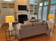 Comfortable living room featuring a fireplace, built-in shelves, and a cozy seating area with hardwood floors at 962 Manor Parc Dr, Decatur, GA 30033