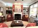Cozy living room featuring a fireplace, built-in shelving, and comfortable seating, perfect for relaxation and entertainment at 962 Manor Parc Dr, Decatur, GA 30033