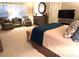 Bright main bedroom with plantation shutters, cozy seating, and ample closet space at 962 Manor Parc Dr, Decatur, GA 30033
