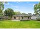 View of the backyard with a large grassy area and a patio at 1826 Terry Mill Se Rd, Atlanta, GA 30316