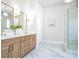 Bright bathroom featuring marble floors, dual sink vanity, and glass-enclosed shower at 1826 Terry Mill Se Rd, Atlanta, GA 30316