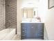 Bathroom with vanity, tub-shower combo with gray subway tile, and tile floors at 1826 Terry Mill Se Rd, Atlanta, GA 30316