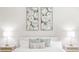 Bedroom view showing the bed, side tables with lamps, and wall art above the headboard at 1826 Terry Mill Se Rd, Atlanta, GA 30316