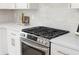 Modern kitchen with gas range stove, stainless steel appliances, and quartz countertop at 1826 Terry Mill Se Rd, Atlanta, GA 30316