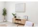 Sitting area with faux wood floors, decorative console table, decorative tree and contemporary artwork at 1826 Terry Mill Se Rd, Atlanta, GA 30316
