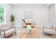 Sitting area with faux wood floors, decorative chairs, decorative coffee table and contemporary artwork at 1826 Terry Mill Se Rd, Atlanta, GA 30316