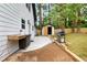 Backyard featuring an outdoor kitchen, patio area, a grill, shed, and mature trees at 2263 Barge Rd, Atlanta, GA 30331