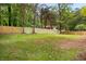 Large, grassy backyard enclosed by a wooden fence, offering privacy and space at 2263 Barge Rd, Atlanta, GA 30331