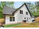 Backyard with a new house, well-maintained lawn, and an outdoor grill at 2263 Barge Rd, Atlanta, GA 30331