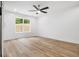 Bright bedroom featuring a ceiling fan and a large window at 2263 Barge Rd, Atlanta, GA 30331