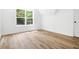 Cozy bedroom with natural light and sleek wood-style flooring at 2263 Barge Rd, Atlanta, GA 30331