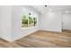 Bright dining room with hardwood floors, large window and modern lighting fixture at 2263 Barge Rd, Atlanta, GA 30331