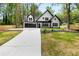 Charming two-story home with a two car garage and well manicured lawn at 2263 Barge Rd, Atlanta, GA 30331