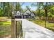Beautiful two-story home with a long driveway and a gated entrance at 2263 Barge Rd, Atlanta, GA 30331