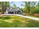 Well manicured lawn in front of a charming two-story home with a two car garage at 2263 Barge Rd, Atlanta, GA 30331