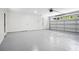 Spacious, clean garage with epoxy flooring, a large garage door, and two interior doors at 2263 Barge Rd, Atlanta, GA 30331
