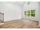 Spacious living room with high ceilings, large windows and wood-style floors at 2263 Barge Rd, Atlanta, GA 30331