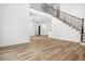 Open-concept floor plan showcasing wood floors and an elegant staircase with iron spindles at 2263 Barge Rd, Atlanta, GA 30331
