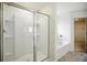 Clean shower and tub featuring chrome finishes and sliding glass door at 2804 Torunn Ct, Atlanta, GA 30331