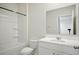 Well-lit bathroom with a tub/shower combination, white vanity, and a mirror reflecting additional space at 2804 Torunn Ct, Atlanta, GA 30331