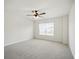 This bedroom features neutral carpet and a ceiling fan with integrated lighting at 2804 Torunn Ct, Atlanta, GA 30331