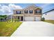 Charming two-story brick home featuring a spacious driveway and attached two-car garage at 2804 Torunn Ct, Atlanta, GA 30331