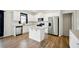 Bright kitchen features stainless appliances, a center island, granite countertops, and white cabinets at 2804 Torunn Ct, Atlanta, GA 30331