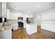 Bright kitchen featuring white cabinets, stainless steel appliances, granite countertops, and a central island at 2804 Torunn Ct, Atlanta, GA 30331