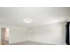 Large living room featuring neutral walls, recessed lighting, and an open doorway to an attached bathroom at 2804 Torunn Ct, Atlanta, GA 30331