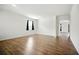 Spacious living room featuring hardwood flooring, white walls and a view into the home at 2804 Torunn Ct, Atlanta, GA 30331