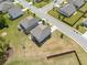 An aerial view highlighting the positioning of two homes, street layout, and surrounding green space at 3360 Meadow Grass Dr, Dacula, GA 30019