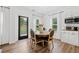 Cozy breakfast nook with a round table, chairs, and a view of the outdoors through a glass panel door at 3360 Meadow Grass Dr, Dacula, GA 30019