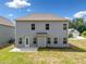 A two-story home with a gray exterior and backyard at 3360 Meadow Grass Dr, Dacula, GA 30019